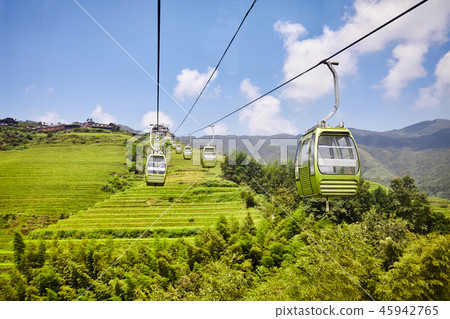 Cable car above the Longji Rice Terraces, China. Cable car above the Longji Rice Terraces, China. 45942765