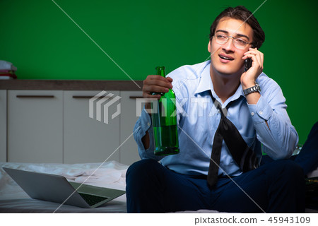 Young businessman under stress in the bedroom at night 45943109