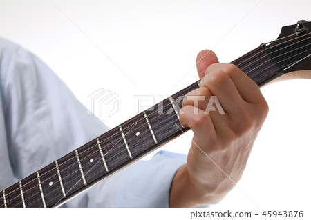 Male arms playing classic shape electric guitar 45943876