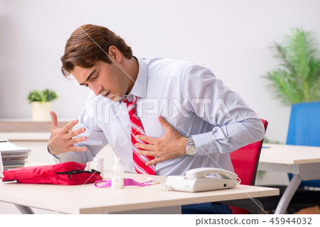 Man with first aid kit in the office Man with first aid kit in the office 45944032