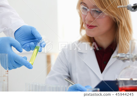 Technician hold in arms in protective gloves 45944245