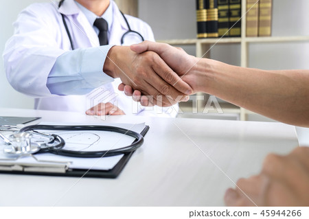 Professor Doctor having shaking hands with patient after recomme Professor Doctor having shaking hands with patient after recomme 45944266