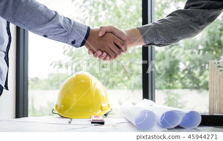 Shaking hands of collaboration, Construction engineering or arch 45944271