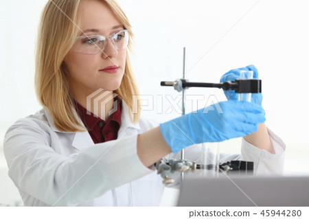 Technician hold in arms in protective gloves Technician hold in arms in protective gloves 45944280