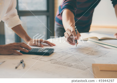 Team of Construction engineering or architect hands working on b Team of Construction engineering or architect hands working on b 45944297