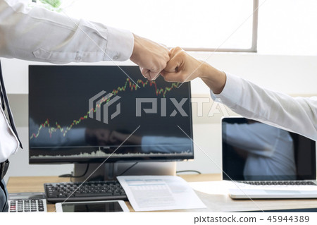 Finishing up a meeting, giving first bump of hand's two happy bu Finishing up a meeting, giving first bump of hand's two happy bu 45944389