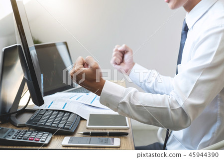Businessman trading stocks online, stock broker looking at graph Businessman trading stocks online, stock broker looking at graph 45944390