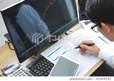 Stock exchange market concept, stock broker looking at graph wor 45944391