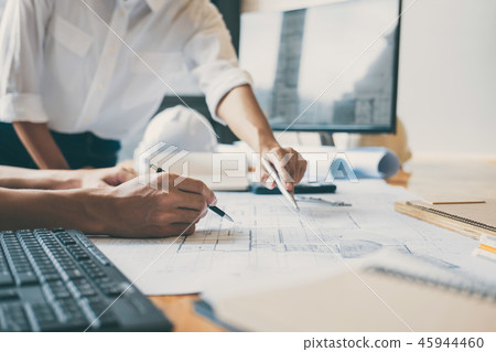 Team of Construction engineering or architect hands working on b 45944460