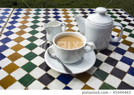 Pot of tea on ceramic tiled table in Moroccan cafe Pot of tea on ceramic tiled table in Moroccan cafe 45944463