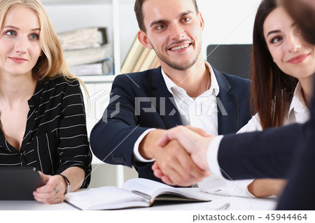 Smiling arab man in suit shake hands Smiling arab man in suit shake hands 45944464