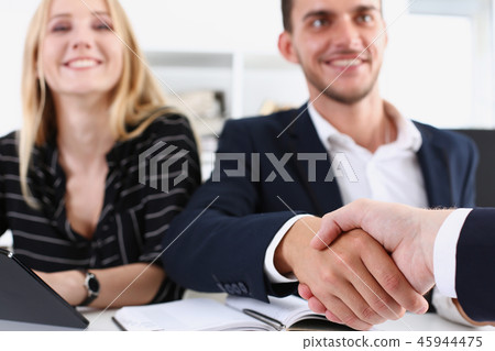 Smiling arab man in suit shake hands Smiling arab man in suit shake hands 45944475