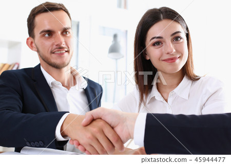 Smiling arab man in suit shake hands Smiling arab man in suit shake hands 45944477