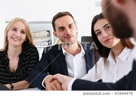 Smiling arab man in suit shake hands Smiling arab man in suit shake hands 45944479