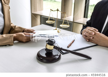 Business woman giving bribe money the form of dollar bills to ma 45944516