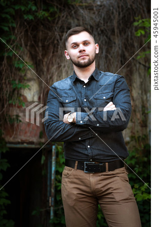 portrait of a Young man in a shirt and trousers portrait of a Young man in a shirt and trousers 45945001