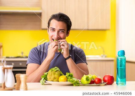 Young man in dieting and healthy eating concept 45946006