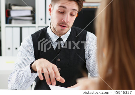 Handsome man in suit offer contract form Handsome man in suit offer contract form 45946337