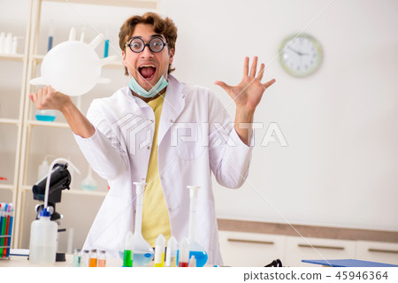 Funny crazy chemist doing experiments and tests 45946364