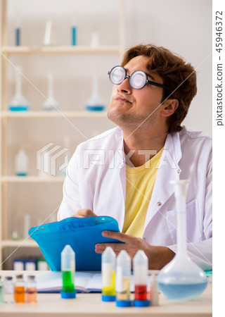 Funny crazy chemist doing experiments and tests 45946372