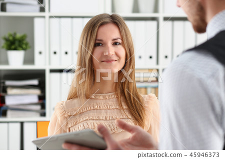 Beautiful smiling cheerful girl at workplace Beautiful smiling cheerful girl at workplace 45946373