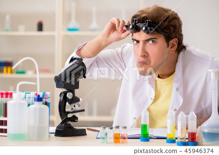 Funny crazy chemist doing experiments and tests Funny crazy chemist doing experiments and tests 45946374