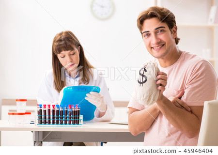 Man giving his blood as a donor 45946404