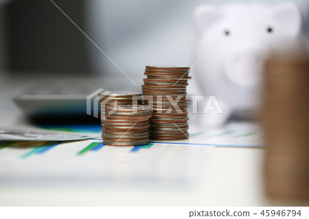 Towers of coins on background office. 45946794