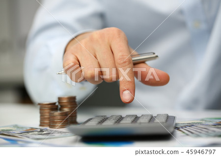 Male hand push key silver calculator is lying Male hand push key silver calculator is lying 45946797
