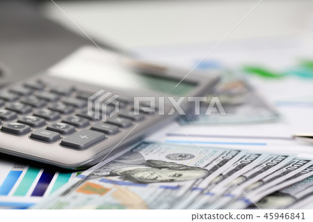 Silver calculator with gray keyboard is lying Silver calculator with gray keyboard is lying 45946841
