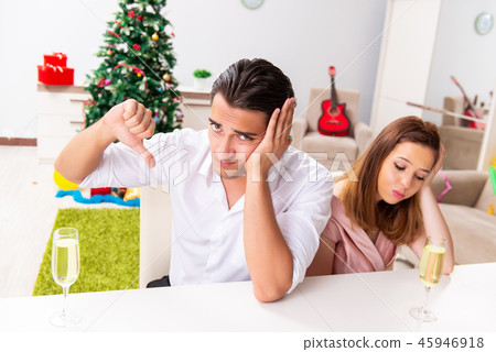 Young pair conflicting at christmas night Young pair conflicting at christmas night 45946918