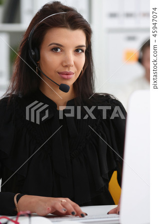 Three call centre service operators at work 45947074