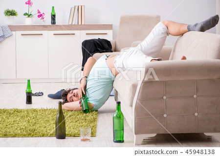 Young drunk handsome man after party at home  45948138