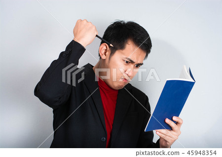 Angry businessman shout with book 45948354