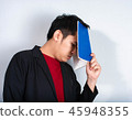 Angry businessman shout with book 45948355
