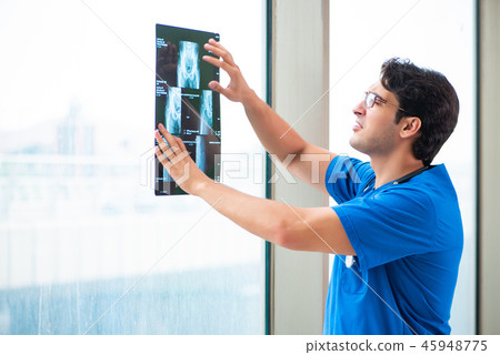 Young handsome doctor working in the hospital  45948775