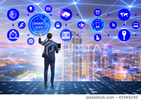 Concept of smart city with businessman pressing buttons Concept of smart city with businessman pressing buttons 45949240