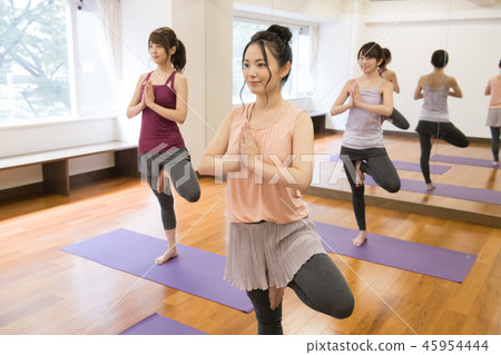 Young Japanese Woman Doing Yoga Tree Pose 45954444