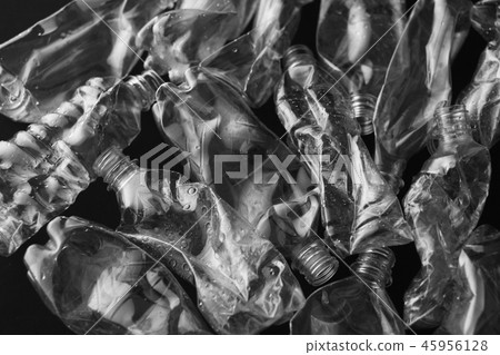 Crushed plastic bottle inside black background 45956128