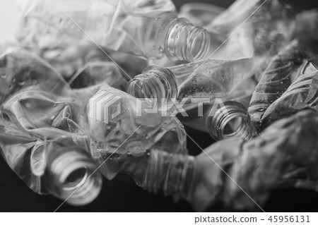 Crushed plastic bottle inside black background 45956131
