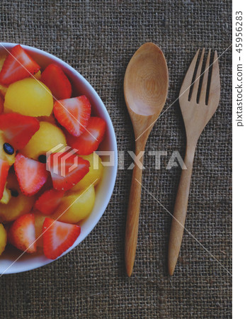 strawberry and watermelon with wood spoon. 45956283