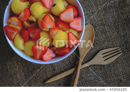 strawberry and watermelon with wood spoon. strawberry and watermelon with wood spoon. 45956285