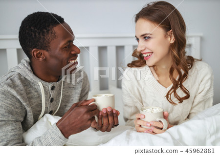 happy loving couple drinking cocoa on winter  45962881