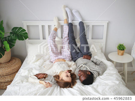 happy couple in love on winter morning in bed 45962883