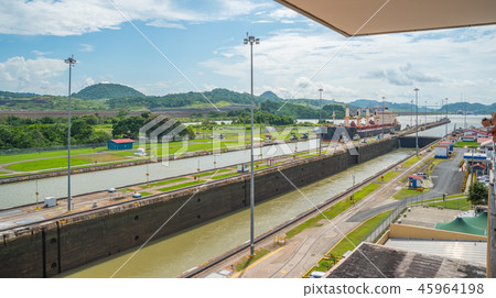 Cargo ship in lift locks of the Panama Canal. Cargo ship in lift locks of the Panama Canal. 45964198