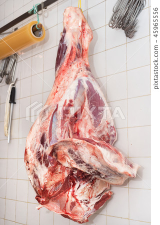 piece of meat hanging in the butcher shop piece of meat hanging in the butcher shop 45965556