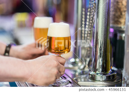 Two beer glasses in the tap of a pub 45966131
