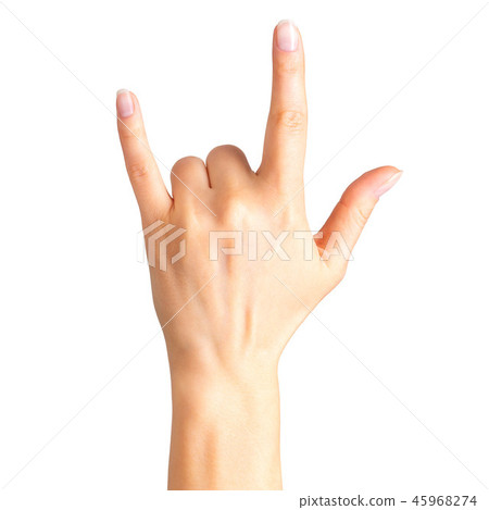 Female hand showing rock n roll sign or giving the devil horns gesture Female hand showing rock n roll sign or giving the devil horns gesture 45968274