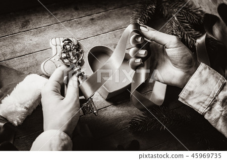 hands wrapping christmas key and gifts hands wrapping christmas key and gifts 45969735