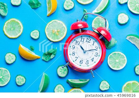 cutted lemons and limes and alarm clock cutted lemons and limes and alarm clock 45969816